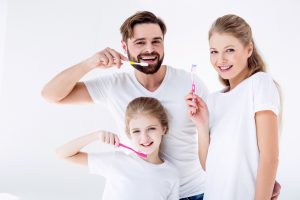 Family brushing teeth