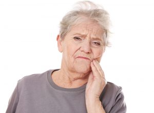 Grandma suffering with a tooth pain