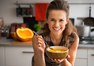 Lady eating pumpkin