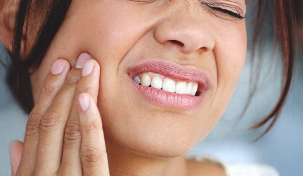 Lady suffering with toothache